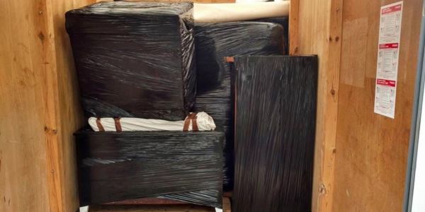 Movers loading furniture into truck