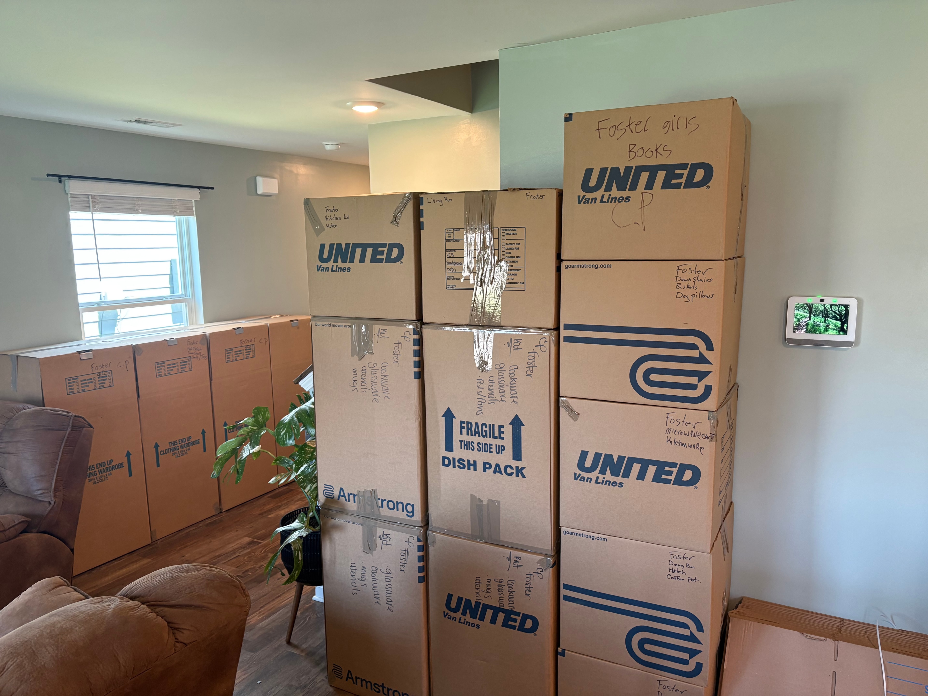 Moving boxes stacked in home